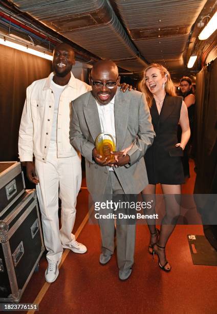 Stormzy, Edward Enninful, winner of the Trailblazer Award, and Jodie Comer pose backstage at The Fashion Awards 2023 presented by Pandora at The...