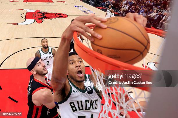 Giannis Antetokounmpo of the Milwaukee Bucks dunks the ball during the second half against the Chicago Bulls at the United Center on November 30,...