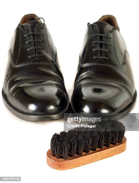 black shoes with polishing brush - shoe polish stock pictures, royalty-free photos & images