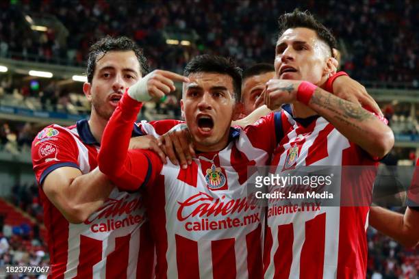 Fernando Beltran of Chivas celebrates with teammates after scoring the team's first goal during the quarterfinals first leg match between Chivas and...