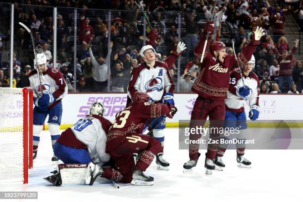 Nick Bjugstad of the Arizona Coyotes celebrates after scoirng the game winning goal during the overtime period against the Colorado Avalanche at...