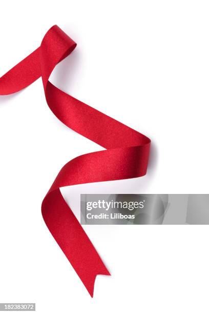 red ribbon - satin ribbon stock pictures, royalty-free photos & images