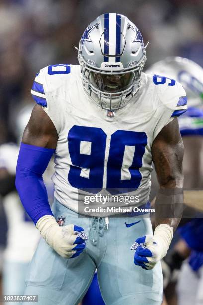 DeMarcus Lawrence of the Dallas Cowboys celebrates after forcing a turnover on fourth down during an NFL football game between the Dallas Cowboys and...