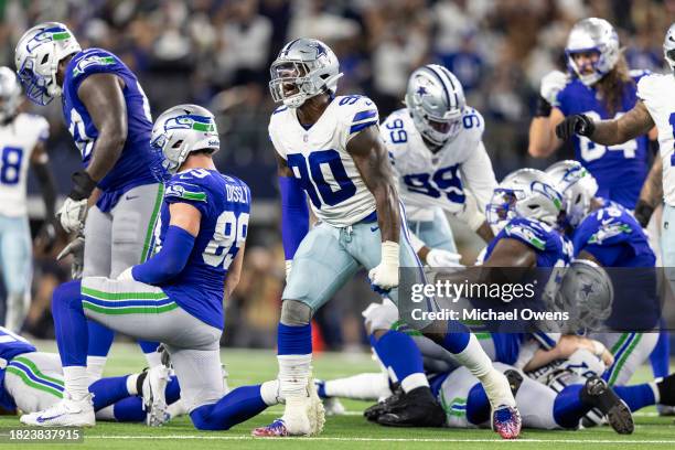 DeMarcus Lawrence of the Dallas Cowboys celebrates after forcing a turnover on fourth down during an NFL football game between the Dallas Cowboys and...