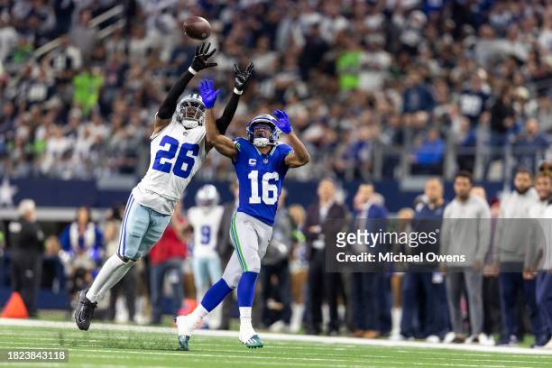 DaRon Bland of the Dallas Cowboys intercepts a pass intended for Tyler Lockett of the Seattle Seahawks during an NFL football game between the Dallas...