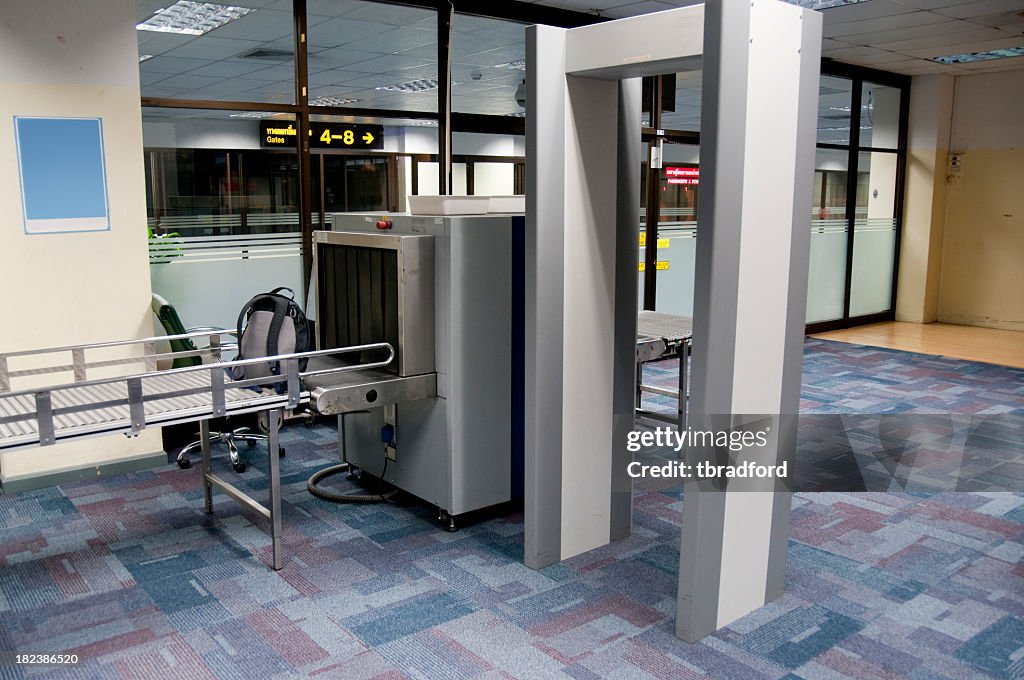 Luggage and body scanner in an airport security check point