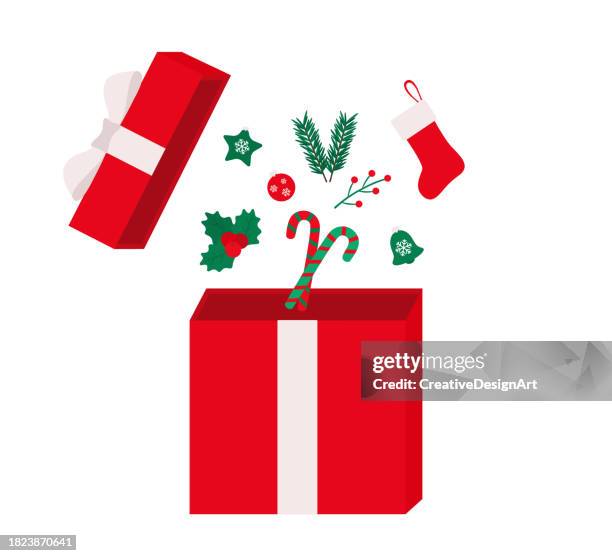 open red christmas gift box with decorative objects, pine ball, candy canes, mistletoe and christmas stocking. merry christmas and happy new year concept - christmas present stock illustrations