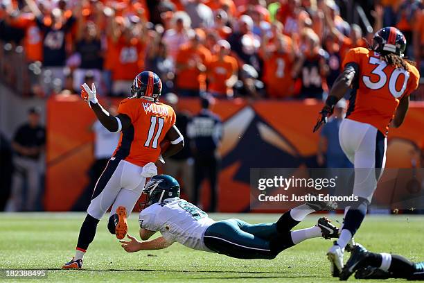 Kick returner Trindon Holliday of the Denver Broncos runs past kicker Alex Henery of the Philadelphia Eagles on his way to scoring on a 105-yard...