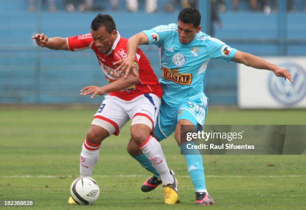 Jesus ALvarez of Sporting Cristal fights for the ball with Roberto Jimenez of Union Comercio during a match between Sporting Cristal and Union...