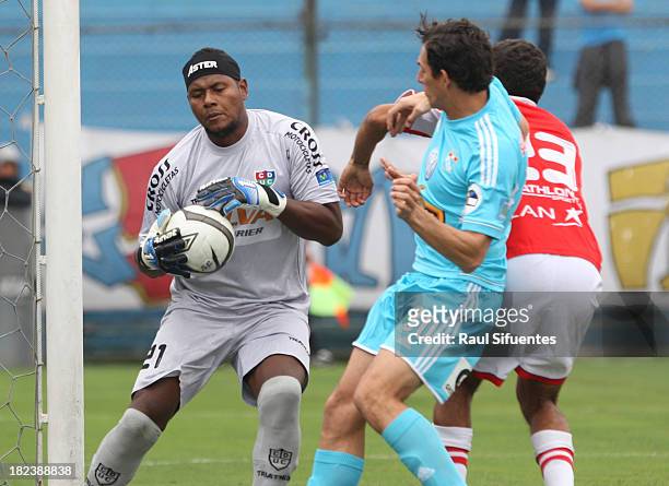 Jose Carlos Fernandez of Sporting Cristal fights for the ball with Juan Flores of Union Comercio during a match between Sporting Cristal and Union...