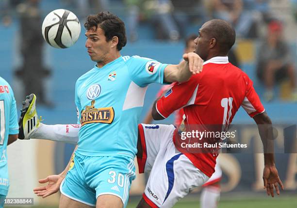 Jose Carlos Fernandez of Sporting Cristal fights for the ball with Sidney Faiffer of Union Comercio during a match between Sporting Cristal and Union...