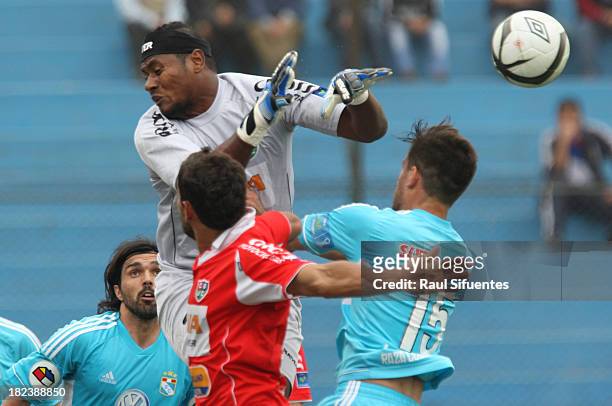 Nicolas Ayr of Sporting Cristal fights for the ball with Juan Flores of Union Comercio during a match between Sporting Cristal and Union Comercio as...