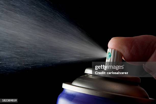 spraying aerosol can isolated in black - spray cleaner stock pictures, royalty-free photos & images