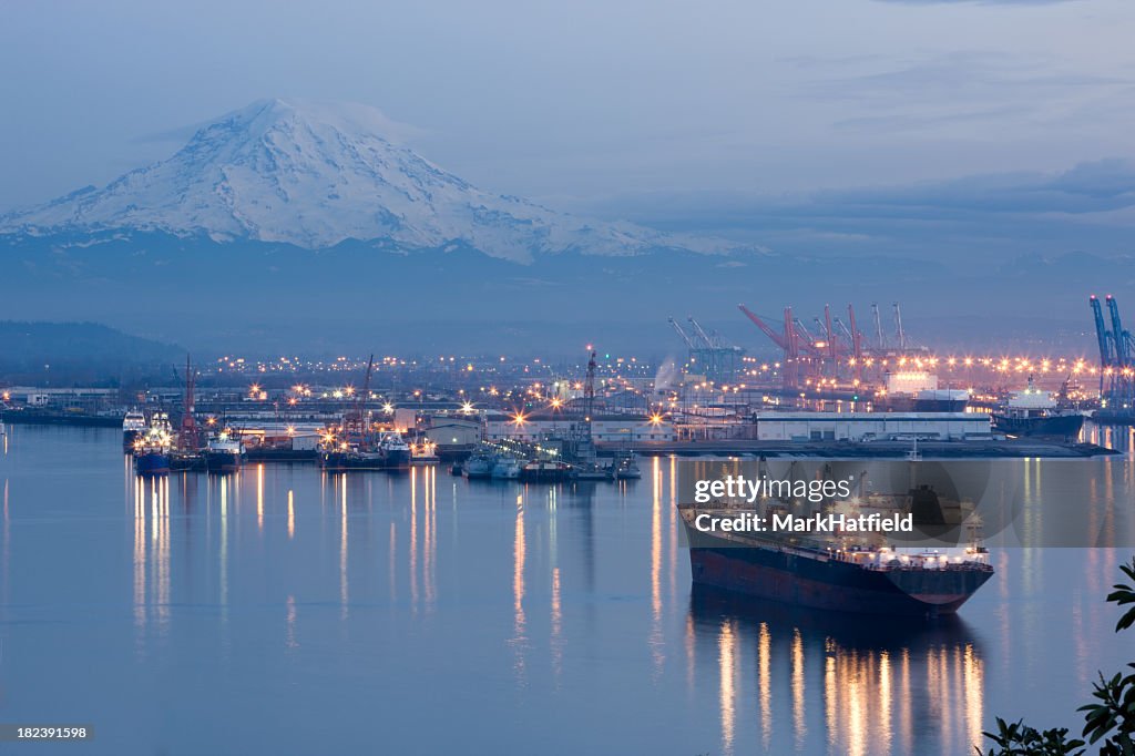 A photo of port Tacoma and a snow topped Mount Rainier