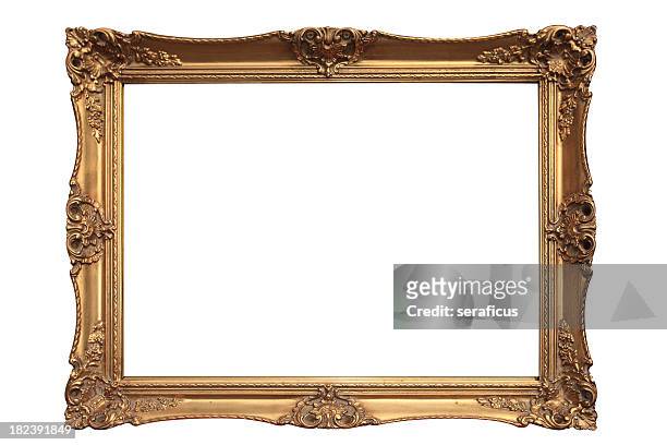 empty gold ornate picture frame with white background - ouderwets stockfoto's en -beelden