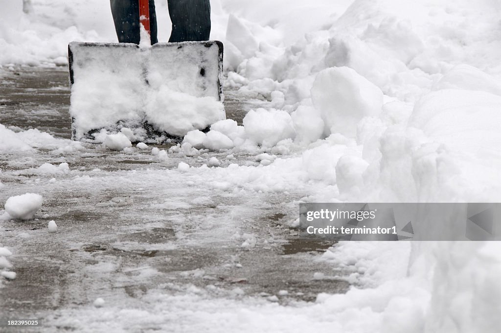 Shoveling Snow from Sidewalk