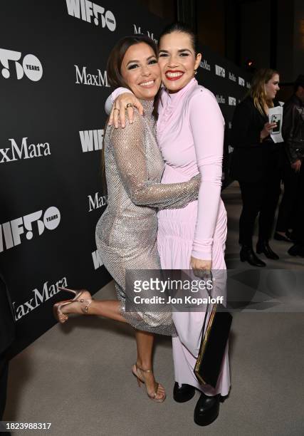 Eva Longoria and America Ferrera, both wearing Sportmax, attend WIF Honors Presented by Max Mara on November 30, 2023 in Los Angeles, California.