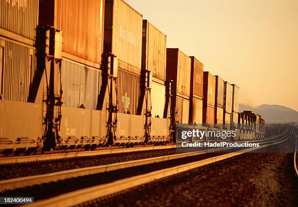 long freight train with containers - railings stock pictures, royalty-free photos & images