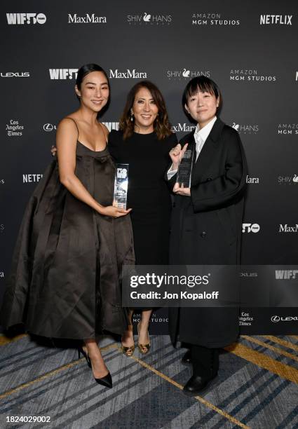 Janice Min with Winners of the Crystal Award for Advocacy Greta Lee and Celine Song, both wearing Max Mara, pose backstage during WIF Honors...