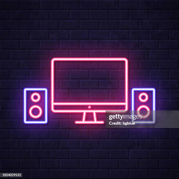desktop computer with speakers. glowing neon icon on brick wall background - recording studio wall stock illustrations