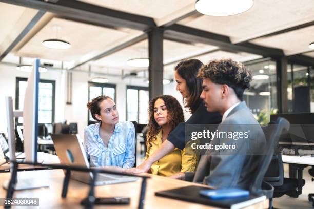 diverse business team discussing at desk - gender equality stock pictures, royalty-free photos & images