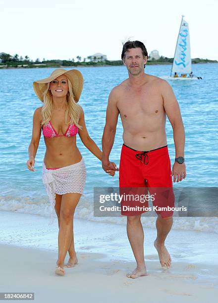 Television personality Gretchen Rossi and Slade Smiley enjoy the beach at Sandals Emerald Bay after the Golf Clinic with Greg Norman and Golf...