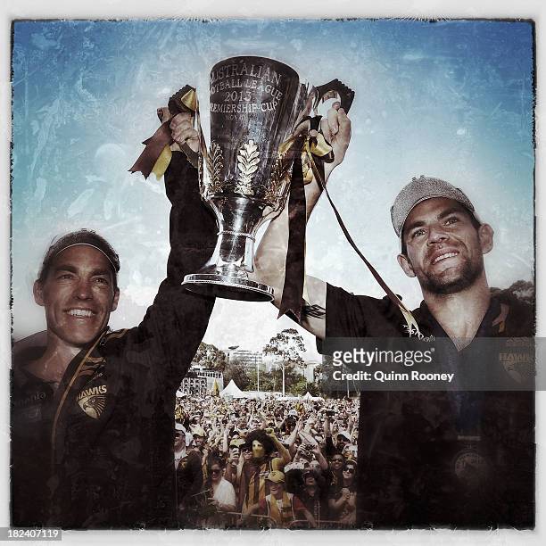 Alastair Clarkson the coach and Luke Hodge the captain of the Hawks holds up the Premiership Cup during the Hawthorn Hawks Fan Day at Glenferrie Oval...