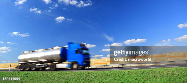 sky over blue truck on a highway - gas truck stock pictures, royalty-free photos & images