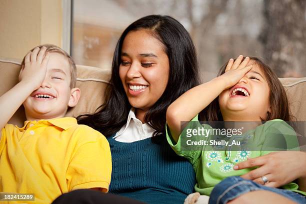 silly laughing children - babysit stockfoto's en -beelden