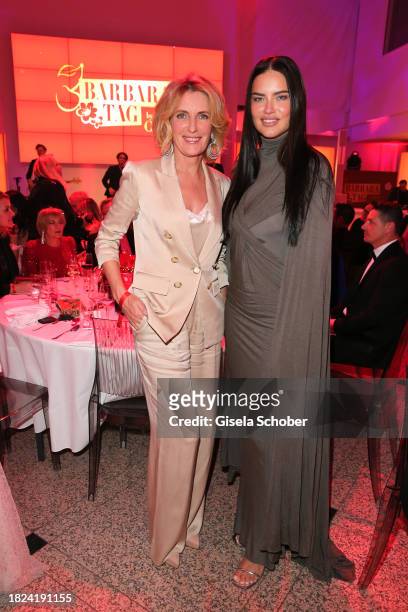 Maria Furtwängler and super model Adriana Lima during the 15th Mon Cheri hosts Barbara Tag at Isarpost on December 4, 2023 in Munich, Germany.