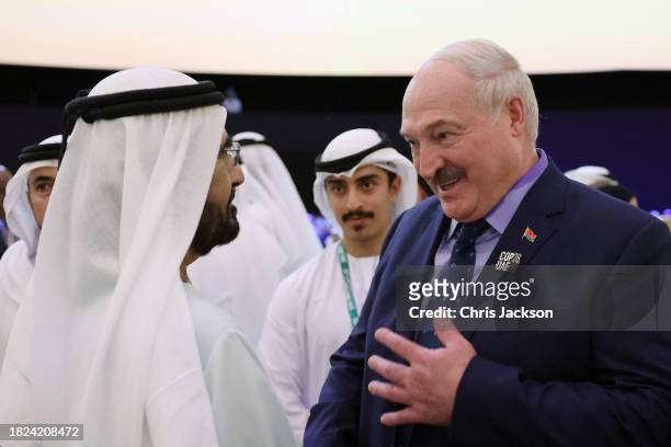 Vice President of the United Arab Emirates Mohammed bin Rashid Al Maktoum greets President of Belarus Aleksandr Lukashenko as they attend the opening...