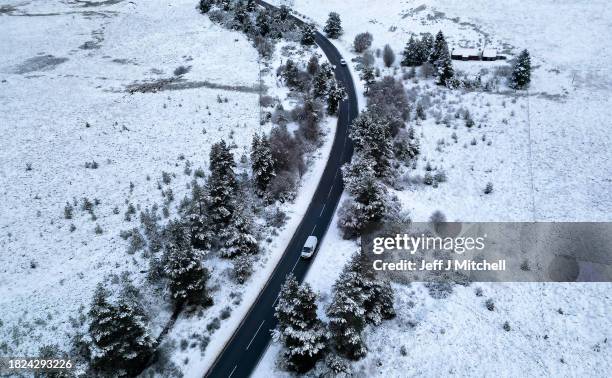 Vehicles travel along the A939 as the freezing temperatures continue on December 01, 2023 in Grantown on Spey, Scotland. On Thursday, the Met Office...