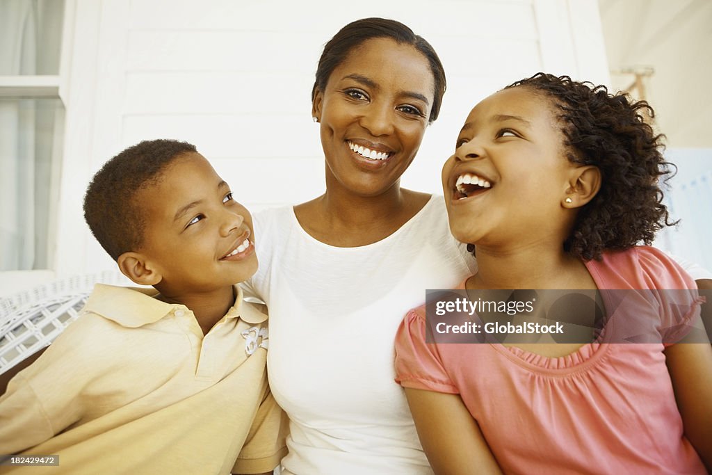 Mother smiling with son and daughter