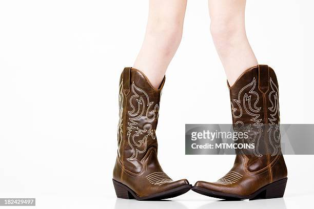 child in boots - mtmcoins stockfoto's en -beelden