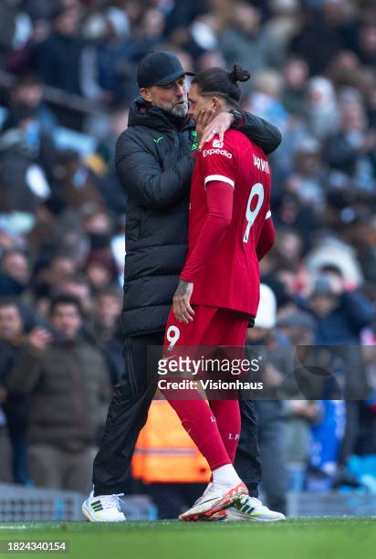 Liverpool manager Jurgen Klopp greets Darwin Nunez after the Premier League match between Manchester City and Liverpool FC at Etihad Stadium on...