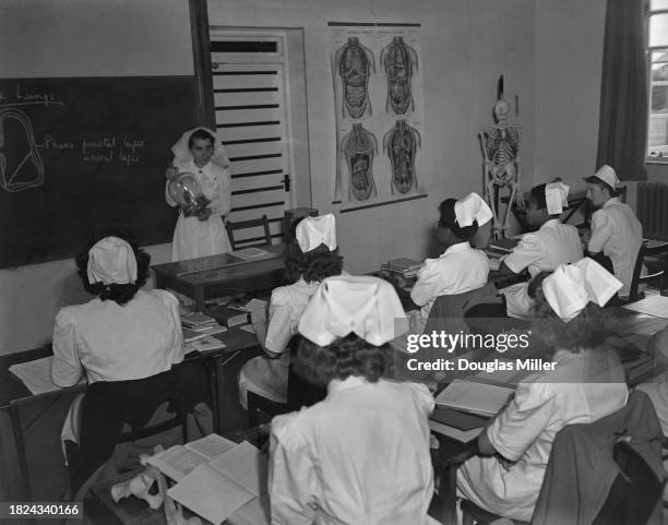 Student nurses during an anatomy lesson at Stoke Mandeville Hospital, Buckinghamshire, September 1948.