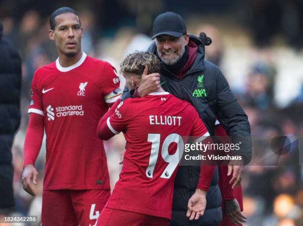 Liverpool manager Jurgen Klopp greets Harvey Elliott after the Premier League match between Manchester City and Liverpool FC at Etihad Stadium on...
