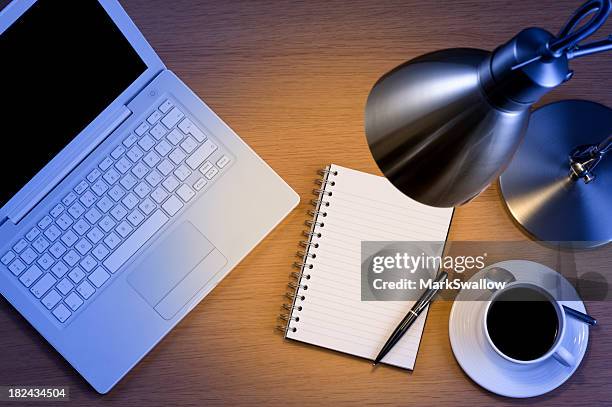 silver desk lamp laptop pen and notepad and black coffee - angle poise lamp stock pictures, royalty-free photos & images