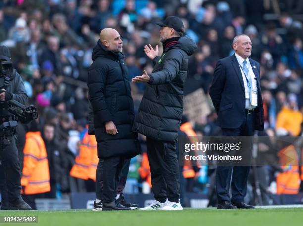 Manchester City manager Pep Guardiola and Liverpool manager Jurgen Klopp exchange words after the Premier League match between Manchester City and...