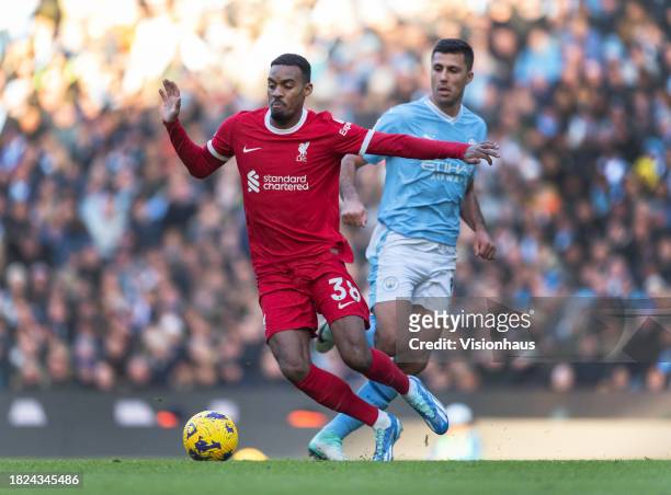 Ryan Gravenberch of Liverpool and Rodri of Manchester City in action during the Premier League match between Manchester City and Liverpool FC at...