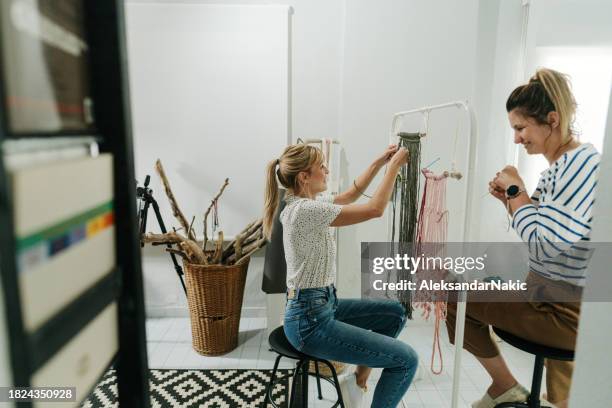 craftswomen weaving makrame in a workshop - macrame stock pictures, royalty-free photos & images