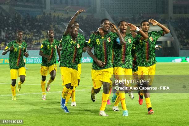 Ibrahim Diarra of Mali celebrates after scoring the team's first goal with teammates during the FIFA U-17 World Cup 3rd Place Final match between...