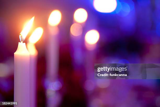 candles on a table - purple candles stock pictures, royalty-free photos & images