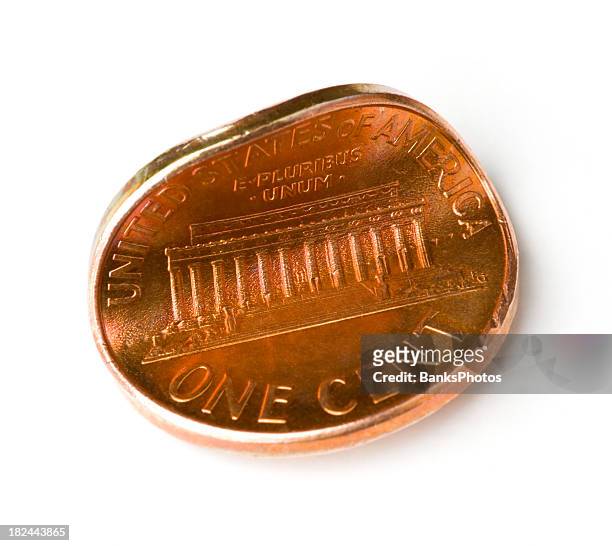 one pinched penny on white - one cent coin stock pictures, royalty-free photos & images