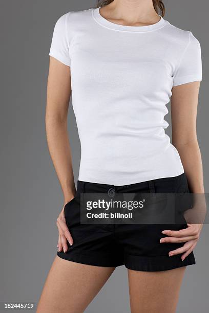 young woman wearing white top and black shorts - blank t shirt model stock pictures, royalty-free photos & images