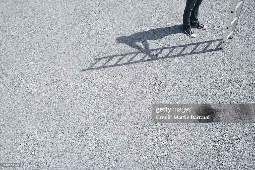 Man standing outdoors near ladder