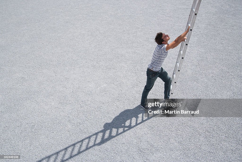 Man climbing ladder outdoors