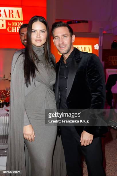 Super model Adriana Lima and Marcel Remus during the Mon Cheri Hosts Barbara Tag at Isarpost on December 4, 2023 in Munich, Germany.