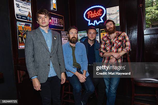 Rollum Haas, Matt Pelham, Mark Bond and Roger Dabbs of the Features pose backstage before performing an EndSession hosted by 107.7 The End at the J&M...