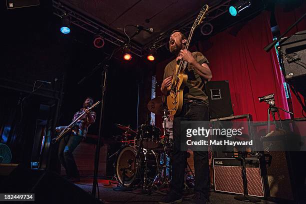 Bassist Roger Dabbs and singer/guitarist Matt Pelham of the Features perform during an EndSession hosted by 107.7 The End at the J&M Cafe on...